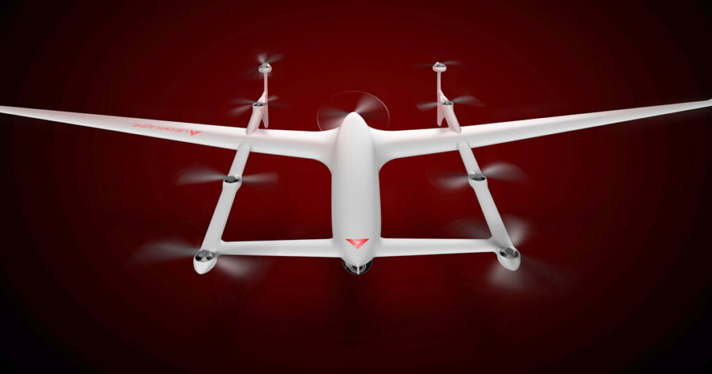 AutoFlight white drone in flight against a dark red backdrop.