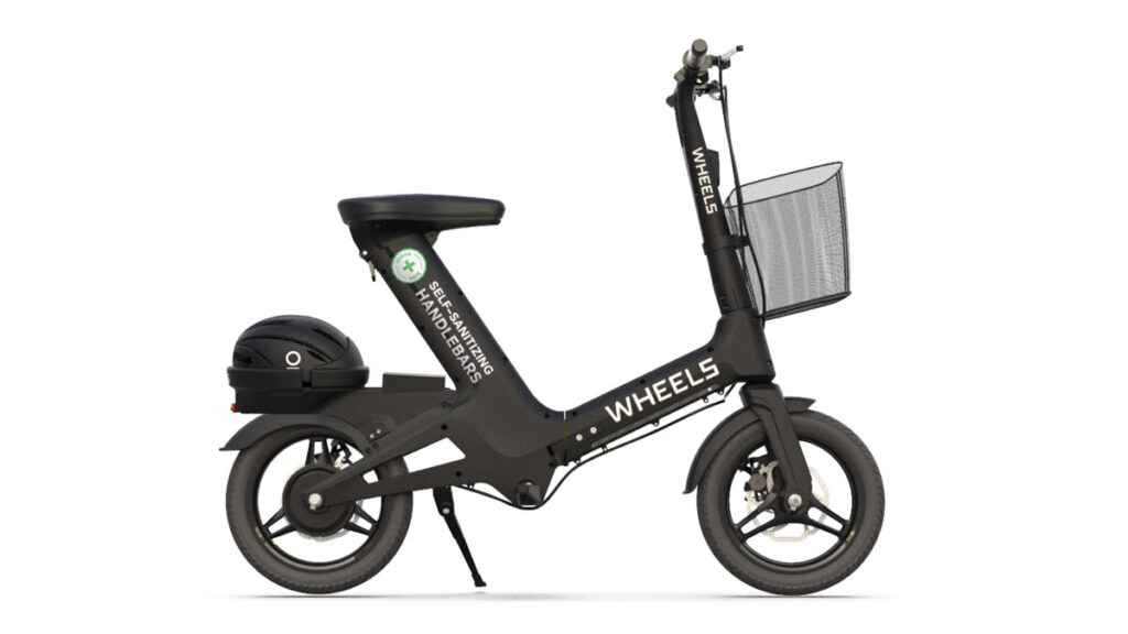 Black electric scooter with basket and helmet.