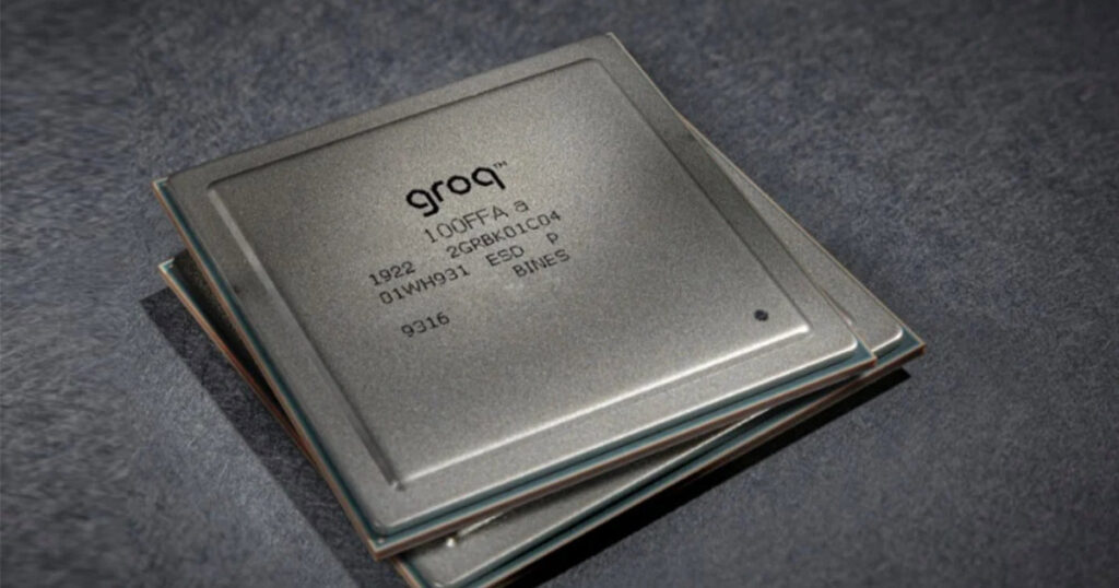 Stack of Groq semiconductor chips on a dark textured background.