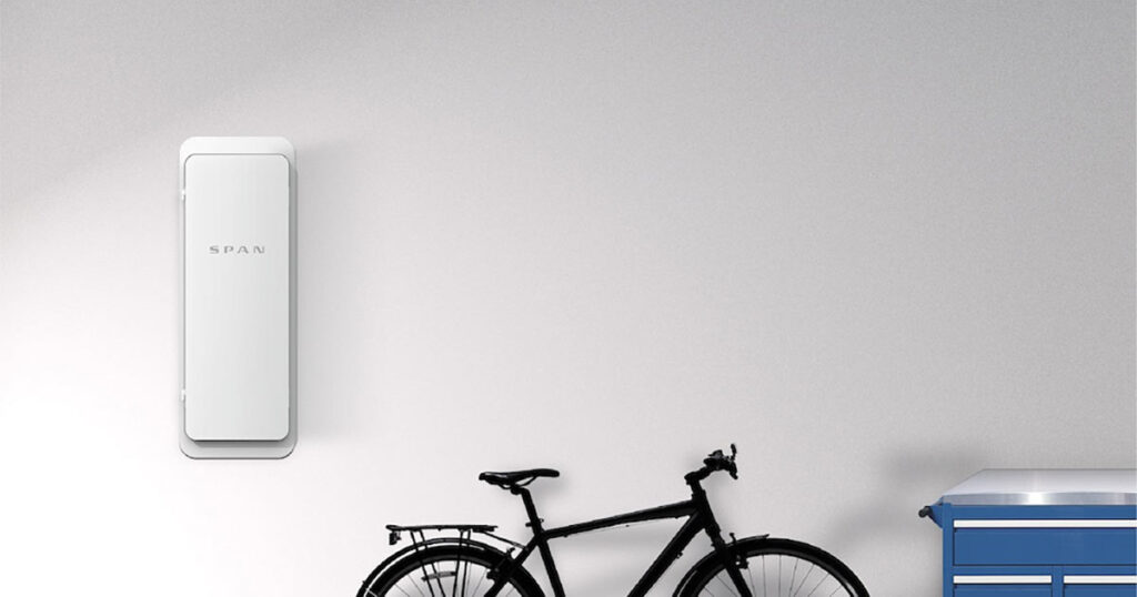 Minimalist garage interior with a wall-mounted Span unit and a black bicycle to the side.