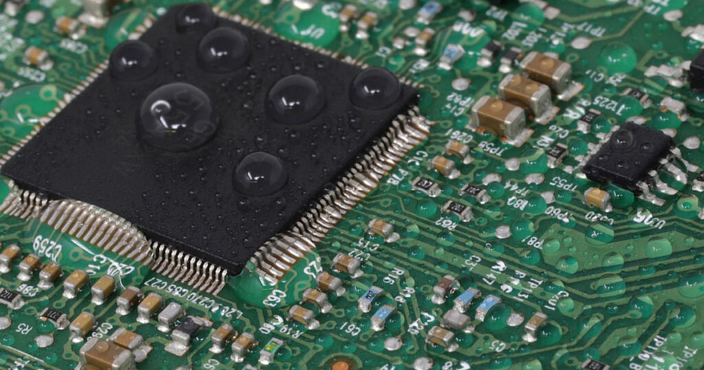 Close-up of an electronic circuit board with microchips and components.