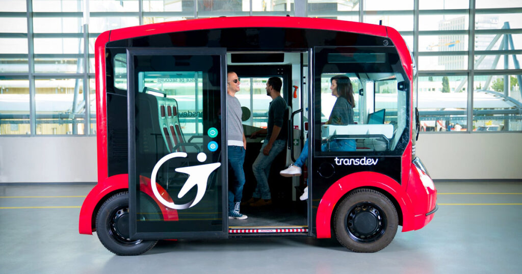 Accessible electric shuttle vehicle designed for mobility-impaired passengers.