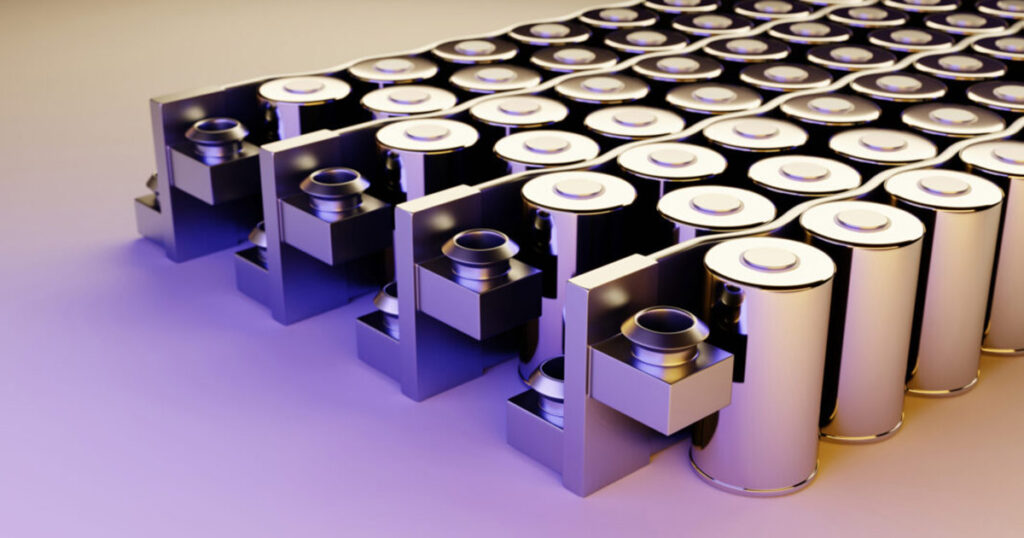 Array of lithium-ion batteries organized in rows on purple background.