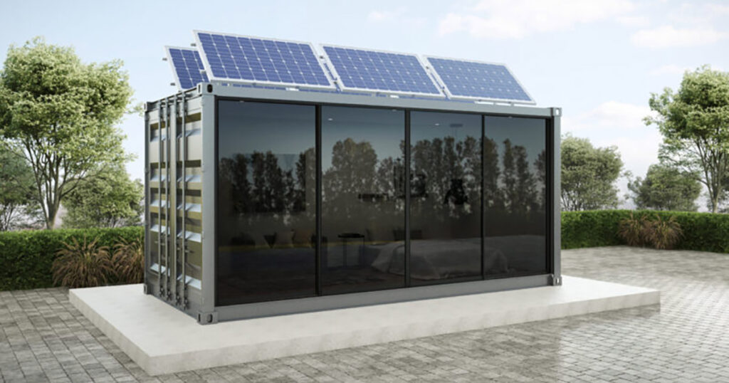 Modern container office equipped with solar panels on roof, outdoor setting.