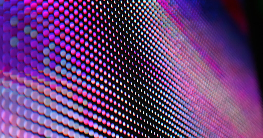 Close-up view of an LED screen displaying vibrant colors.