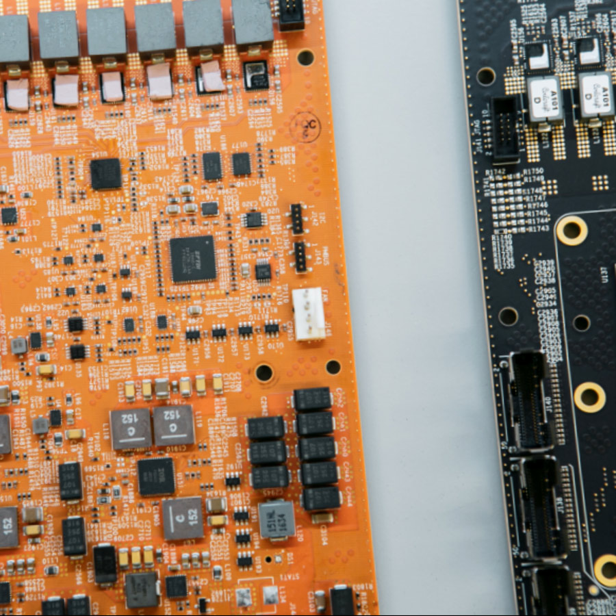 Close-up of orange and black circuit boards.