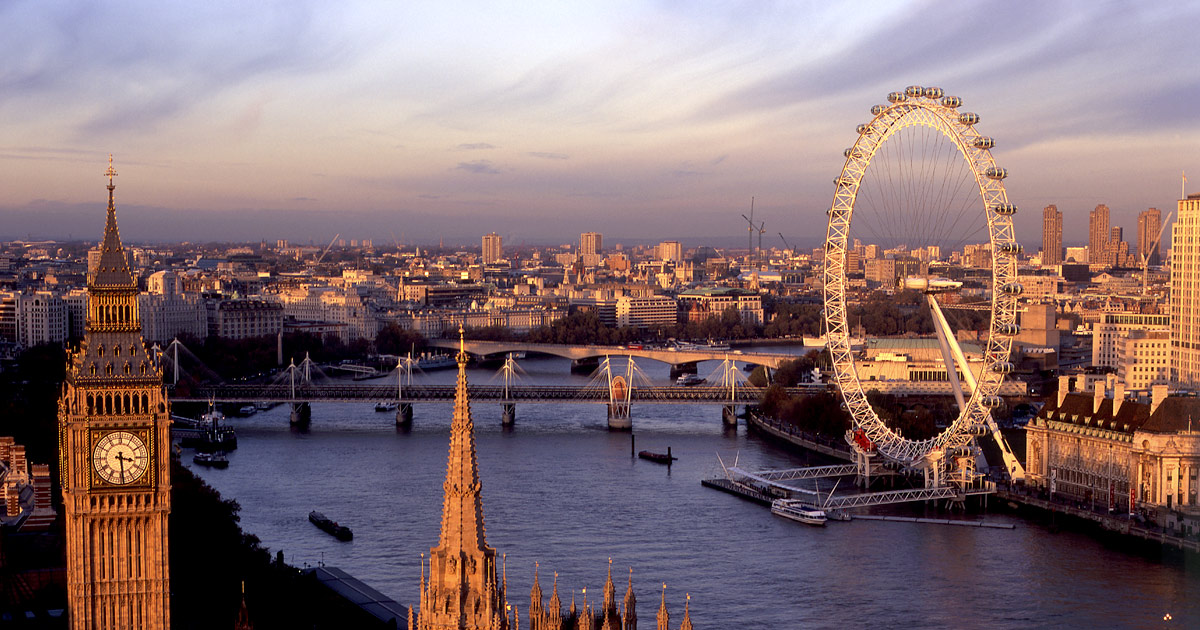 Sunset view of London's skyline featuring Big Ben and the London Eye.