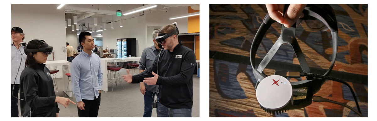 People using VR headsets during a demo session at an office.